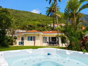 a bath tub in front of a house at Humboldt Garden in La Orotava +40 photos