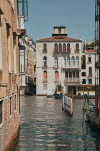 a view of a canal in a city with buildings at Maison Spada in Venice +11 photos