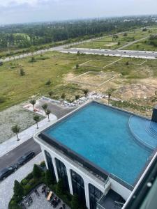 an overhead view of a swimming pool in a building at L'Azur Cửa Lò in Cửa Lô
