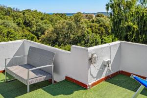 an outdoor area with a volley ball net and chairs at Villa Rosa in Olbia