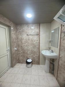a bathroom with a sink and a toilet at Full moon in Yerevan +11 photos