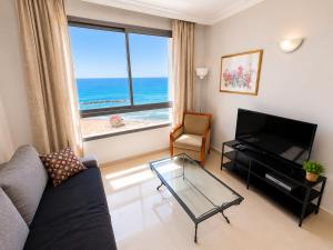 a living room with a view of the ocean at Azure apartments Haifa in Haifa