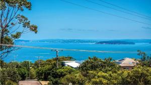 a view of a large body of water at 'Gone Coastal' by HolidayCo in Killcare