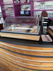 a display case on a counter in a store at Das Alpenglühn Hotel & Restaurant in Krün