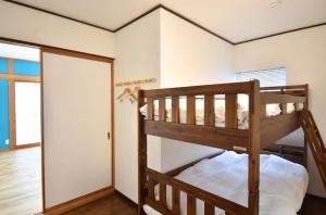 a bedroom with two bunk beds in a room at Sunrise Resort Aji in Takamatsu +8 photos