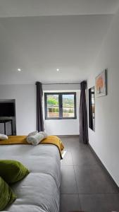 a bedroom with a large bed and a window at EL BATAN Hotel & Spa in Castillo de Locubín +29 photos