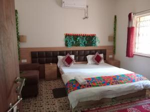 a bedroom with a large bed and a couch at A2 Guest House in Salt Lake City