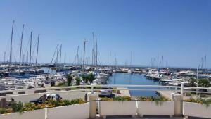 a marina with lots of boats in the water at Villa stella di mare in Capitana
