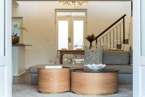 a living room with a couch and a table at Winelands Golf Lodges 3 in Stellenbosch