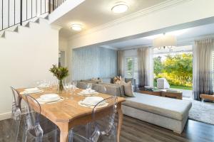 a living room with a table and a couch at Winelands Golf Lodges 3 in Stellenbosch
