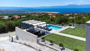 an aerial view of a villa with a swimming pool at Villa Luminosa by Villas Guide in Kraljevica