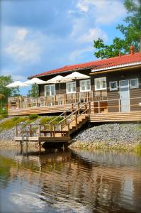 a house on a bridge over a river at Ahlström Ruukki Noormarkku in Pori