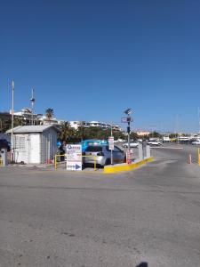 a parking lot with a car parked at a gas station at Pension Castello in Rethymno +24 photos