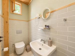 a bathroom with a sink and a toilet and a mirror at Sea Salt Inn in Kemer +44 photos