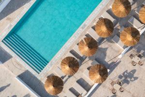 an overhead view of umbrellas next to a swimming pool at Sun Beach Lindos in Lartos