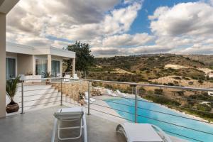a house with a balcony with a swimming pool at Elaia Bioglam Relais in Casa Modica
