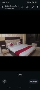 a picture of a bedroom with a bed in a room at Hotel Travora Suits -Lalquila in Bhubaneshwar