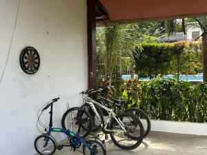 a group of bikes parked next to a wall at Itawis Resort - Nature Chalet in Silang