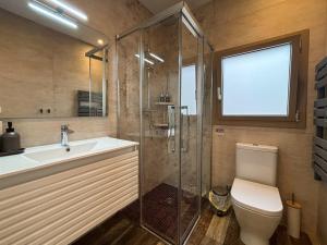 a bathroom with a toilet and a sink and a shower at Ca La Fustereta in Figueres +29 photos