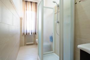 a bathroom with a shower and a sink at Casa Corniolo Near Arezzo in Monte San Savino