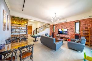 a living room with a brick wall at Canova Homestay in Ji'an