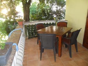 a table and chairs on the back of a patio at Appartments with breakfast "Jagoda" in Banjol