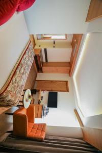 an overhead view of a living room with a staircase at Hotel Grand regus in Bangalore