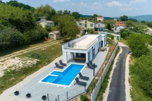 an aerial view of a house with a swimming pool at Villa Nono in Motovun