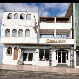 a white building with a sign on it at Zigal hotel in Antofagasta