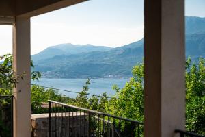 a view of a lake from a house balcony at Villa Stari Mlin in Luštica +53 photos