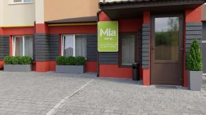 a building with a mta sign in front of it at Mia Hotel in Rivne