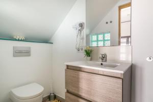 a bathroom with a sink and a toilet at Girasol in Vejer de la Frontera +14 photos