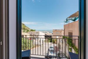 a view of a street from a balcony at Cerri Hotel in Castellammare del Golfo