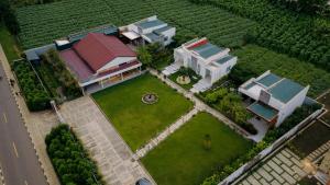 an aerial view of a house with a garden at Skojet Boutique Hotel in Ruhengeri
