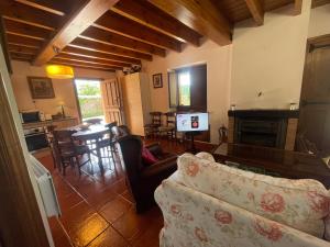 a living room with a couch and a table at VILLA ISABEL in Piloña