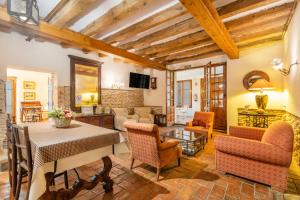 a living room with a table and chairs at Petit Ca l'Andorrà in Vila-Sana