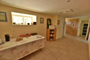 a living room with a table and a window at Clos Pimi in Monbazillac