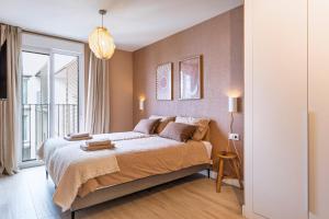 a bedroom with a large bed and a large window at Casa Arena Rosa in Jávea +28 photos