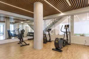 a gym with treadmills and exercise equipment in a building at Casa Arena Rosa in Jávea
