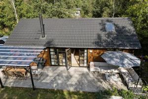 an overhead view of a house with a patio at Nordic Nature Hideaway in Yderby