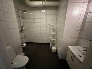 a white bathroom with a toilet and a sink at Sörbyvägen 4 in Floby +47 photos