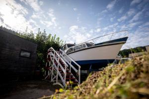 a boat is parked next to a staircase at Das Boot Triberg in Triberg +7 photos