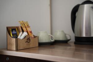 a box on a counter next to a coffee pot at Quatro Life Hotel in Bodrum City