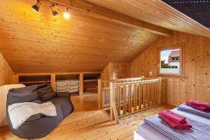 a log cabin with a bean bag chair in a room at Ferienhaus Sonne in Hohnstein