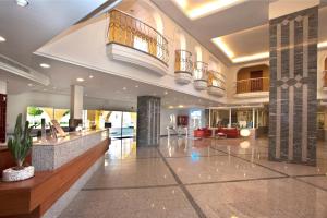 a lobby of a hotel with a reception desk at Palm Oasis Maspalomas in Maspalomas