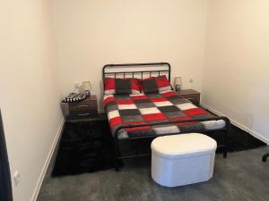 a bedroom with a bed and two night stands at Apartmán Vodolka in Odolena Voda