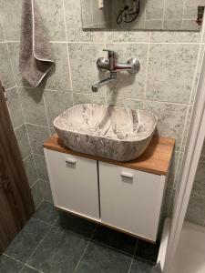 a bathroom with a sink with a faucet at Apartmán Vodolka in Odolena Voda