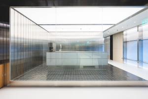a lobby with a glass wall in a building at Takt Jongno Female Only Capsule Hotel in Seoul