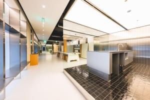 an office lobby with glass walls and a cafeteria at Takt Jongno Female Only Capsule Hotel in Seoul
