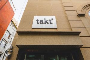 a take sign on the side of a building at Takt Jongno Female Only Capsule Hotel in Seoul +20 photos